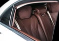 Modern Luxury car inside. Interior of prestige modern car. Comfortable leather seats. Red and white perforated leather. Royalty Free Stock Photo