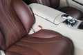 Modern Luxury car inside. Interior of prestige modern car. Comfortable leather seats. Red and white perforated leather cockpit Royalty Free Stock Photo