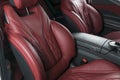 Modern Luxury car inside. Interior of prestige modern car. Comfortable leather red seats. Red perforated leather cockpit Royalty Free Stock Photo