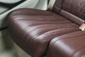 Modern Luxury car inside. Interior of prestige modern car. Comfortable leather seats. Red and white perforated leather. Royalty Free Stock Photo