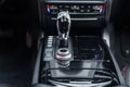 Modern luxury car interior. Control panel, radio system, shift lever. Automatic transmission gearshift stick. Selective Royalty Free Stock Photo