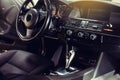 Modern luxury car Interior - steering wheel, shift lever and dashboard. Royalty Free Stock Photo