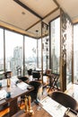 Modern luxury decorated interior restaurant that can view Bangkok cityscape. Elegant design for fine dining