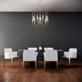 Modern luxury dinning room interior design with white chairs, dining table and chandelier. wooden floor and gray wall Royalty Free Stock Photo