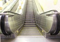 Modern luxury escalators . video of a moving excavator steps changing. with staircase in a shopping mall Metal excavator Royalty Free Stock Photo