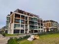 Modern luxury four story residential building during overcast weather