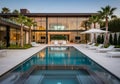 Modern luxury house featuring expansive glass walls and clean lines, complemented by a spacious Royalty Free Stock Photo