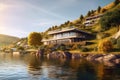 Modern luxury house, villa by water in mountains in summer. Landscape with residential mansion, river, forest and sky. Concept of