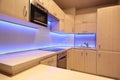 Modern luxury kitchen with purple LED lighting Royalty Free Stock Photo