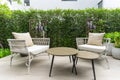 Patio. Garden. Outdoor living space with couch, table and pillow.