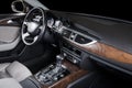 Modern luxury prestige car interior, dashboard, steering wheel.