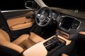 Modern luxury prestige car interior, dashboard, steering wheel.