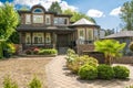 Modern luxury residential house with paved driveway on cloudy sky background Royalty Free Stock Photo