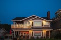 Modern luxury villa exterior. Luxury Home Exterior at Night, Beautiful New House with Landscaping at Twilight Royalty Free Stock Photo