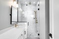 A modern, luxury white bathroom with gold hardware. Royalty Free Stock Photo