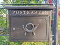 Modern mailbox with posthorn symbol