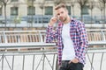 Modern man. Caucasian male resting in street. modern life concept. Young man in checkered shirt. businessman standing Royalty Free Stock Photo