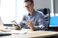 Modern man using credit card and mobile phone for online payment. Mobile shopping concept Royalty Free Stock Photo