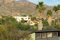 Modern mansions in the hills of the sonora desert in the moutains of arizona with visible palm trees and cactuses