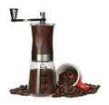 Modern manual coffee grinder with powder, beans and cup on white background Royalty Free Stock Photo