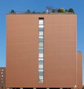 Modern mass built residential building with decorative roof garden