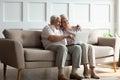 Modern mature couple have fun using laptop at home Royalty Free Stock Photo