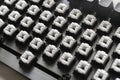 a modern mechanical keyboard switches, black and white keycaps on the desk Royalty Free Stock Photo