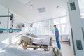 Modern medical chamber with reanimation bed. Interior of reanimation room in modern clinic. Doctor in ward.