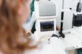 Modern medical equipment. Close up of ophthalmologist using auto refractometer while examining child eyes. Royalty Free Stock Photo