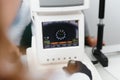 Modern medical equipment. Close up of ophthalmologist using auto refractometer while examining child eyes. Royalty Free Stock Photo