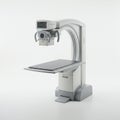 Modern medical imaging machine featuring an integrated digital monitor displaying waveforms.