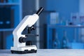 Modern medical microscope on gray table in laboratory, space for text Royalty Free Stock Photo