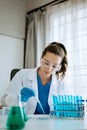 Modern medical research laboratory. female scientist working with micro pipettes analyzing biochemical samples, advanced science