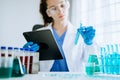 Modern medical research laboratory. female scientist working with micro pipettes analyzing biochemical samples, advanced science Royalty Free Stock Photo