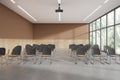 Modern meeting interior with chairs in row and panoramic window Royalty Free Stock Photo