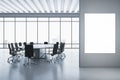 Modern meeting room interior with mock up banner, concrete flooring and panoramic window with city view and daylight. Commercial Royalty Free Stock Photo