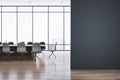 Modern meeting room interior with mock up place on wall, reflections on wooden flooring and panoramic window with city view and Royalty Free Stock Photo
