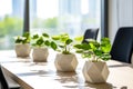 A modern meeting room with vibrant green plants in plaster white pots on a conference table. Concept of business company\'s Royalty Free Stock Photo