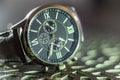 Modern men`s watch, brown-gold color in close up shot