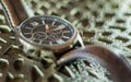 Modern men`s watch, brown-gold color in close up shot