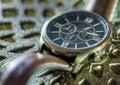 Modern men`s watch, brown-gold color in close up shot