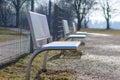 Modern metal benches in park Royalty Free Stock Photo