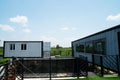 Modern metal building made from shipping house containers and blue sky background