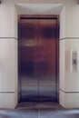 Modern metal elevator close door in building