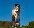 Modern metal sculpture with intricate design outdoors
