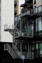 Modern metal stairs on the side of a modern glass building Royalty Free Stock Photo