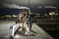 Modern metallic art street sculpture Thinking Man on the waterfront in Copenhagen, Denmark. February 2020