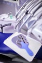 Modern metallic dentist tools and burnishers on a dentist chair in Dentist Clinic