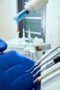 Modern metallic dentist tools and burnishers on a dentist chair in Dentist Clinic