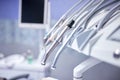 Modern metallic dentist tools and burnishers on a dentist chair in Dentist Clinic